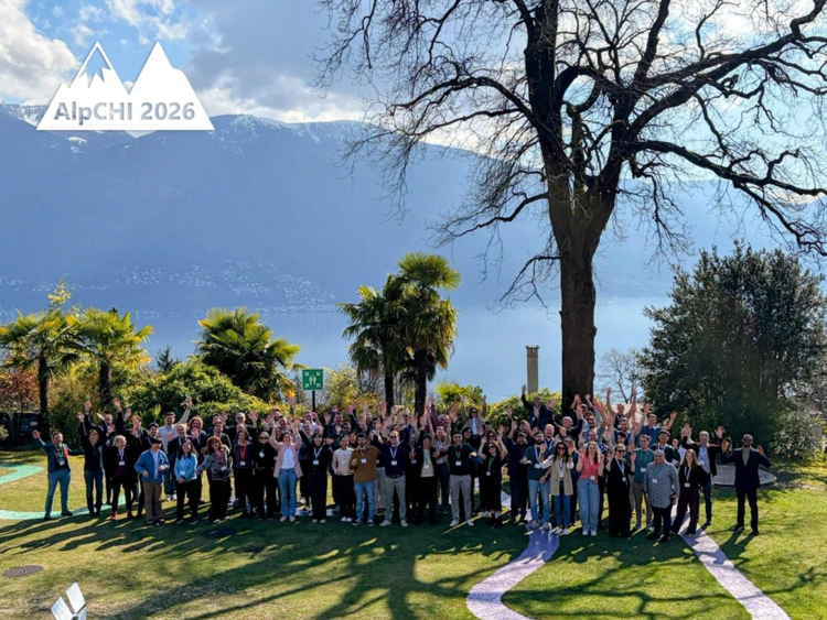 AlpCHI 2026 participants group photo in front of Lago Maggiore. Image credit: **AlpCHI**, 2026.